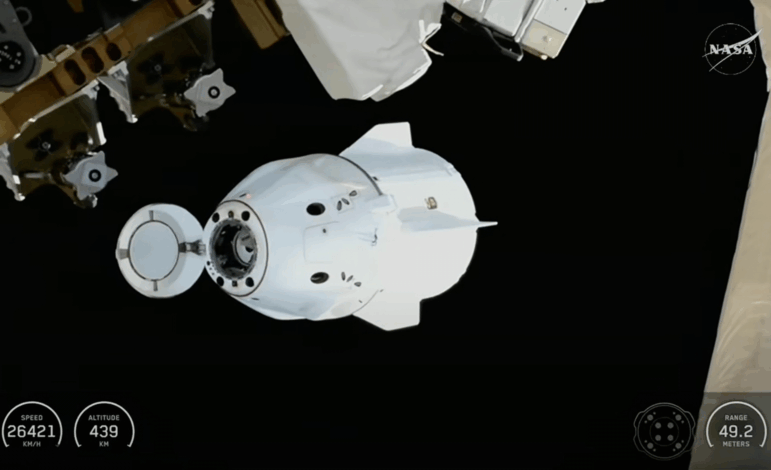 This screengrab from video provided by NASA TV shows the SpaceX Dragon capsule departing from the International Space Station shortly after undocking with four NASA Crew-11 members inside on Wednesday, Jan. 14, 2026.