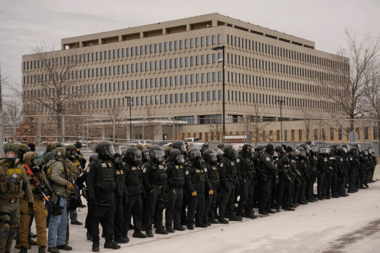Federal immigration officers outside Bishop Henry Whipple Federal Building, Thursday in Minneapolis.