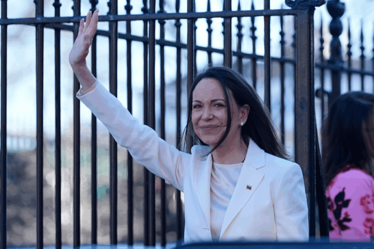 Venezuelan opposition leader María Corina Machado waves to supporters on Pennsylvania Avenue as she leaves the White House after meeting with President Donald Trump Thursday, Jan. 15, 2026, in Washington.