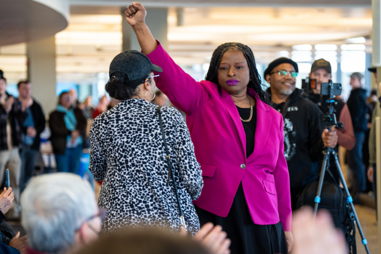 Nekima Levy Armstrong holds up her fist after speaking at an anti-ICE rally for Martin Luther King Jr. on Jan. 19 in St. Paul, Minn.