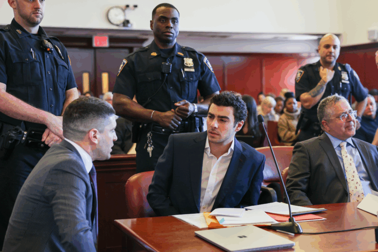 FILE - Luigi Mangione appears in Manhattan Criminal Court for an evidence hearing, Dec. 18, 2025, in New York.