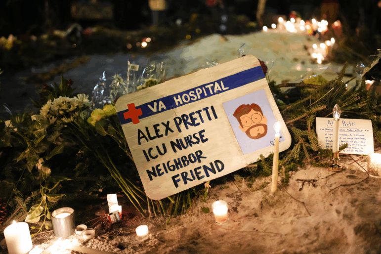 A sign for 37-year-old Alex Pretti, who was fatally shot by a U.S. Border Patrol officer earlier in the day, is displayed during a vigil Saturday, Jan. 24, 2026, in Minneapolis.