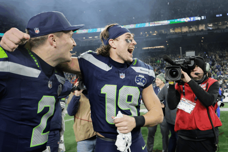 Seattle Seahawks wide receiver Jake Bobo (19) celebrates with quarterback Drew Lock (2) after the NFC Championship NFL football game against the Los Angeles Rams, Sunday, Jan. 25, 2026, in Seattle.
