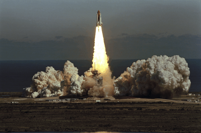 The space shuttle Challenger lifts off from Kennedy Space Center in Florida on January 28, 1986, in a cloud of smoke.