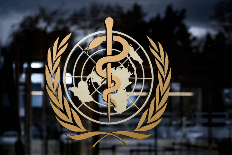 A picture taken on March 9, 2020 shows the sign of the World Health Organization (WHO) at the WHO headquarters in Geneva. - The World Health Organization said on March 9, 2020 that more than 70 percent of those infected with the new coronavirus in China have recovered, adding that the country was "bringing its epidemic under control".