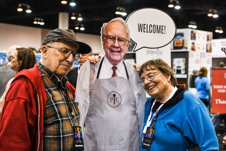 Shareholders pose with a lifesize cardboard cutout of Warren Buffett in 2022, during Berkshire Hathaway's annual shareholders meeting in Omaha, Nebraska.