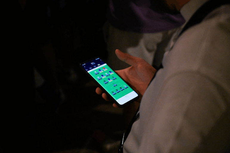 A fan of the French soccer team watches an online sports betting app during the live broadcast of the Euro 2024 semi final, Spain vs France, on the terrace of a bar in Lyon, France, July 9, 2024. (Photo by Matthieu Delaty / Hans Lucas / Hans Lucas via AFP) (Photo by MATTHIEU DELATY/Hans Lucas/AFP via Getty Images)