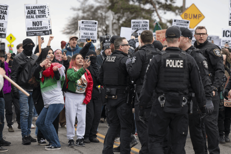 Demonstrators record Seattle police officers during a march against Immigration and Customs Enforcement (ICE) in Seattle on Feb. 8, 2025. Bystander videos have become central to public understanding of many news events.