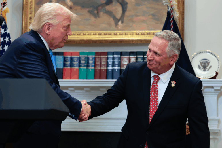 The U.S. Supreme Court has ruled that Illinois Republican U.S. Rep. Mike Bost — seen here with President Trump — has the legal standing to challenge a state law about mail ballots.