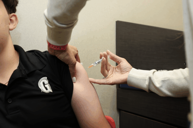 A child receives an immunization at a Florida pediatrician's office in Sept. 2025.