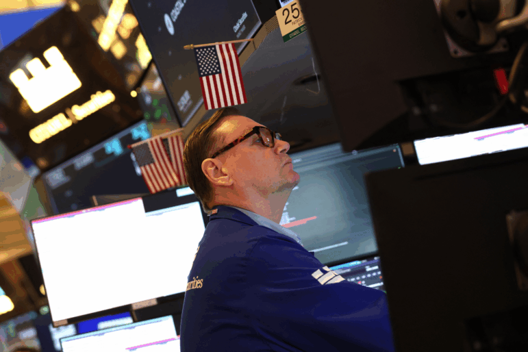 A trader works on the floor of the New York Stock Exchange (NYSE) after the opening bell in New York on January 7, 2026. The Dow Jones Industrial Average hit record highs on Monday and Tuesday, lifted in part by some Venezuela-related stocks.