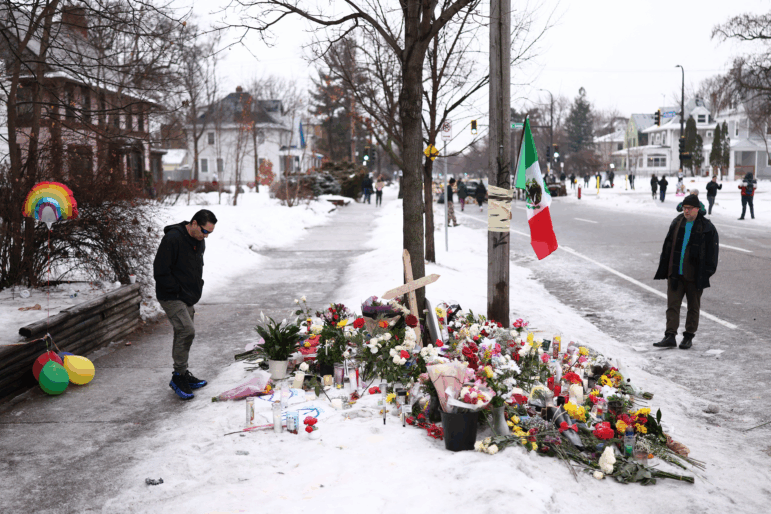 People gather at a makeshift memorial for Renee Nicole Good, 37, who was shot and killed on Wednesday by an ICE officer as she apparently tried to drive away from a group of ICE officers in Minneapolis.
