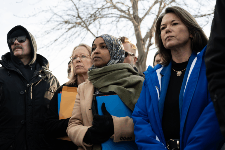 U.S. Rep. Ilhan Omar, joined by Rep. Kelly Morrison (L) and Rep. Angie Craig (R) arrive outside of the regional ICE headquarters at the Whipple Federal Building on Saturday in Minneapolis. The Democratic congresswomen were granted access to the facility initially, but were quickly asked to leave by officials there.