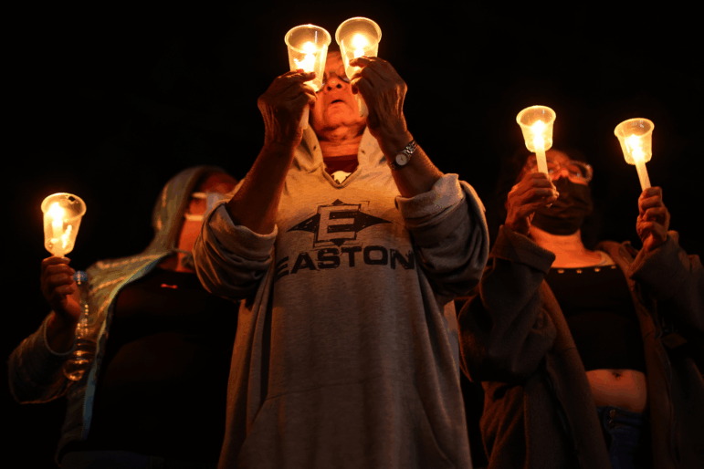 Relatives of prisoners hold candles during a vigil while waiting updates on the release of prisoners outside "El Rodeo" prison on Jan. 09, 2026 in Miranda, Venezuela.