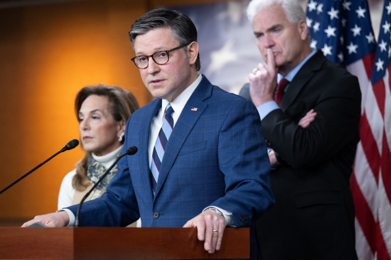 Speaker of the House Mike Johnson, R-La., speaks alongside Republican Conference Chair Representative Lisa McClain, R-Mich., and House Majority Whip Tom Emmer, R-Minn., during a press conference on Capitol Hill in Washington, D.C., on January 21, 2026. (Photo by SAUL LOEB / AFP via Getty Images)
