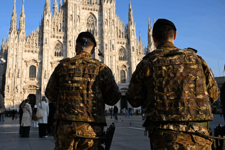 Military personnel stand guard in Piazza Duomo ahead of the Milano Cortina 2026 Olympic Games Milan, Italy, on Monday. Agents from ICE's Homeland Security Investigations unit will also be present at the Games, sparking outrage from some Italian politicians.