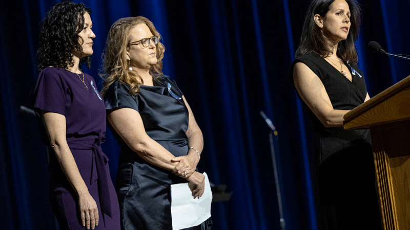 Rachel Feres (left) and other family members speak at a memorial event at DAR Constitution Hall in Washington, D.C. for the 67 people who were killed in the midair collision of a U.S. Army helicopter and an American Airlines regional jet a year ago.
