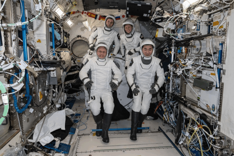 The four SpaceX Crew-11 members gather for a portrait last Friday wearing their pressure suits inside the International Space Station. NASA is returning the crew a month early because one has an undisclosed medical condition. Clockwise from bottom left are, NASA astronaut Mike Fincke, Russian cosmonaut Oleg Platonov, NASA astronaut Zena Cardman, and Japan Aerospace Exploration Agency astronaut Kimiya Yui.
