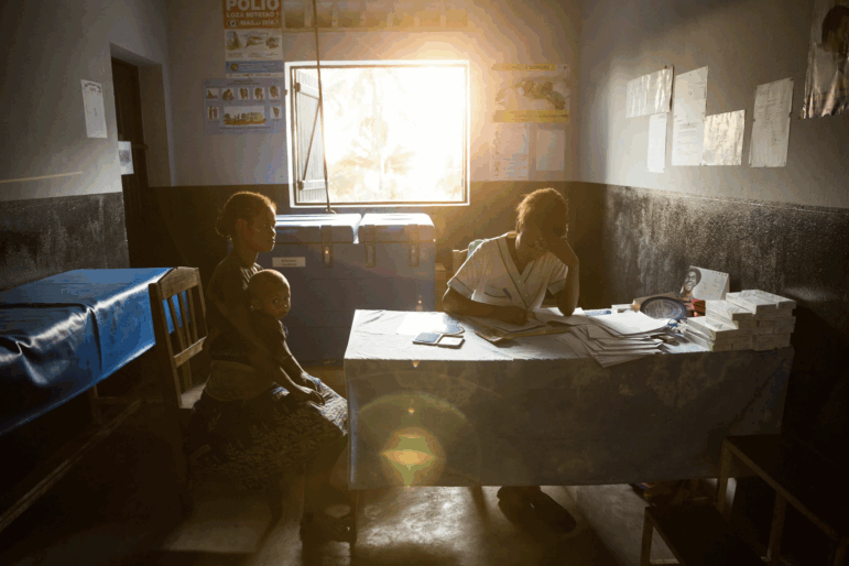 A 19-year-old woman talks with nurse Valeria Zafisoa at a traveling contraception clinic in eastern Madagascar run by the British nonprofit group Marie Stopes International.