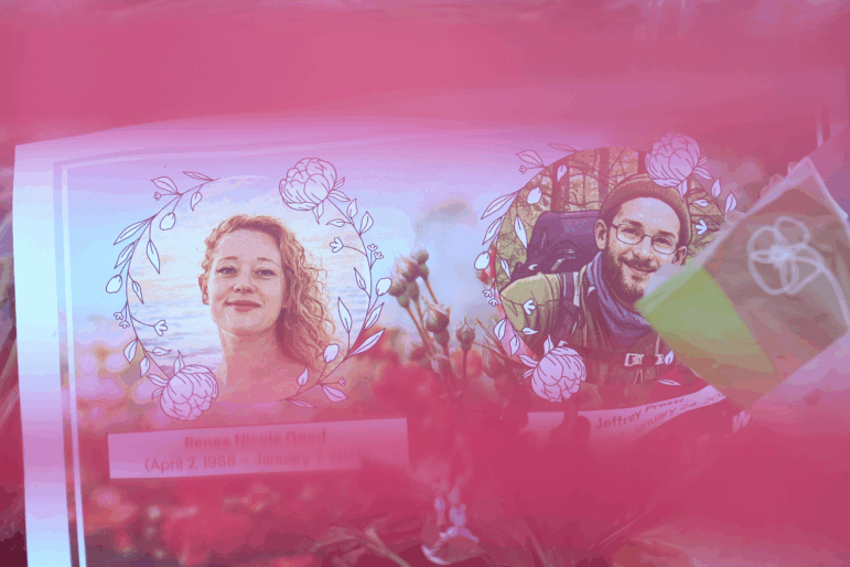 Images of Renee Macklin Good (left) and Alex Pretti, who were both shot and killed by federal immigration officers, are seen at a makeshift memorial at the site where Pretti was killed in Minneapolis.