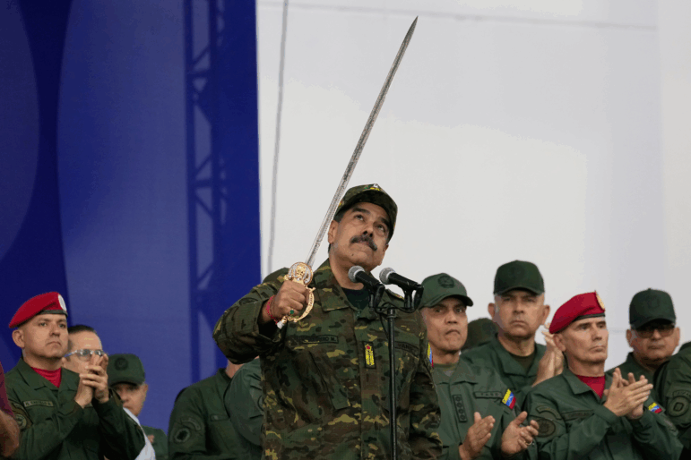 Nicolas Maduro brandishes a sword on Nov. 25, 2025, in Venezuela's capital Caracas, when he was still the country's president. U.S. forces seized Maduro on Jan. 3, part of President Trump's more aggressive foreign policy that has included multiple military operations in the past year.