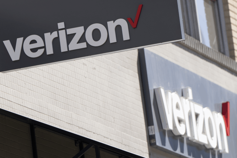 FILE - Signs are displayed outside a Verizon retail location on May 14, 2024, in Portland, Ore. Verizon reports earnings on Monday, July 22, 2024. (AP Photo/Jenny Kane, File)