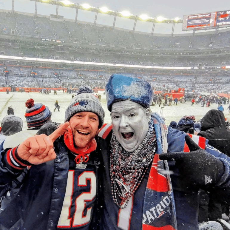Patriots superfan Keith Birchall (R) celebrated with a friend in Denver for the AFC Championship game and was thrilled to see the Pats punch their ticket to this year’s Super Bowl. He’s old enough to remember the Pats’ losing years, and is appalled by the “cockiness and entitlement” in many spoiled young Pats fans today.