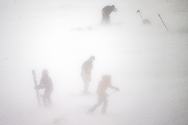 A collection of snow sport enthusiasts brave blowing snow and 20-degree temperatures to ski Horsebarn Hill on Monday afternoon as the last waves pass from a snowstorm that dropped more than a foot of snow across the state in Mansfield, Ct. on Feb. 23.