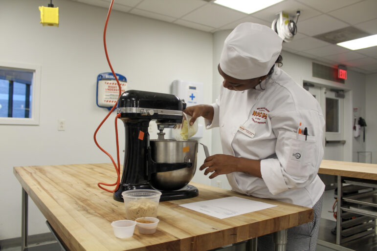 Anthanisha Dandridge mixes a traditional cinnamon filling for her king cake.