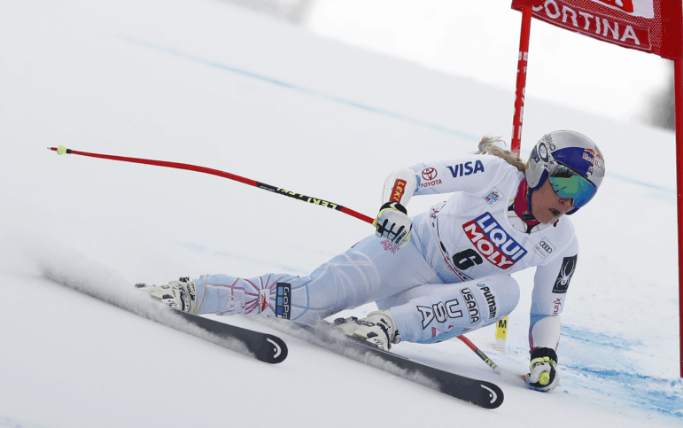 Lindsey Vonn speeds down a snow-covered course in Italy.