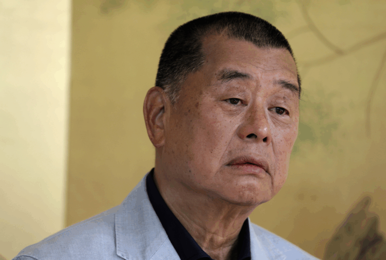 FILE - Hong Kong media tycoon Jimmy Lai pauses during an interview in Hong Kong on July 1, 2020.