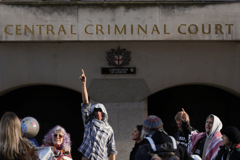 Protesters demonstrate outside The Old Bailey court in London, where four Palestine Action activists are to appear in court charged over a break-in at RAF Brize Norton on June 20 in which aircraft were damaged with spraypaint, Friday, Jan. 16, 2026.
