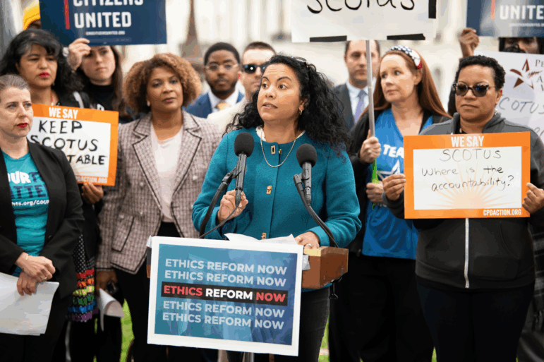FILE - Analilia Mejia, center, speaks during a rally calling for SCOTUS ethics reform, May 2, 2023, in Washington.