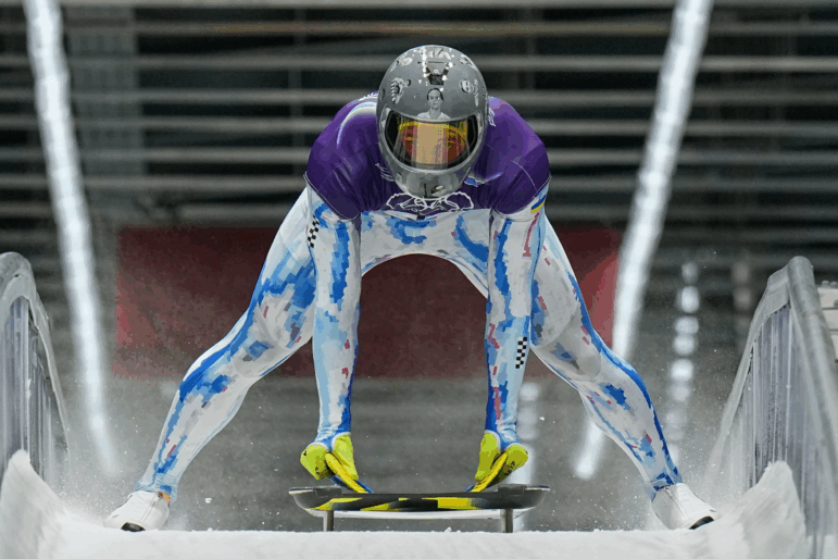Ukraine's Vladyslav Heraskevych arrives at the finish during a men's skeleton training session at the 2026 Winter Olympics, in Cortina d'Ampezzo, Italy, Tuesday, Feb. 10, 2026.
