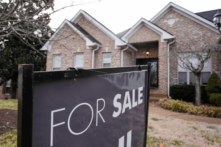 A for sale sign is posted outside a home, Tuesday, Feb. 10, 2026, in Nashville, Tenn.