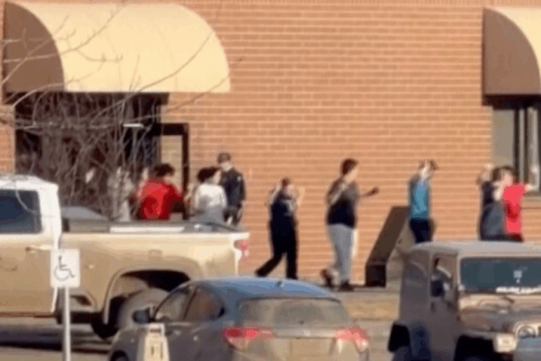 This grab from video shows students exiting the Tumbler Ridge school after deadly shootings, in British Columbia, Canada, Tuesday Feb. 10, 2026.