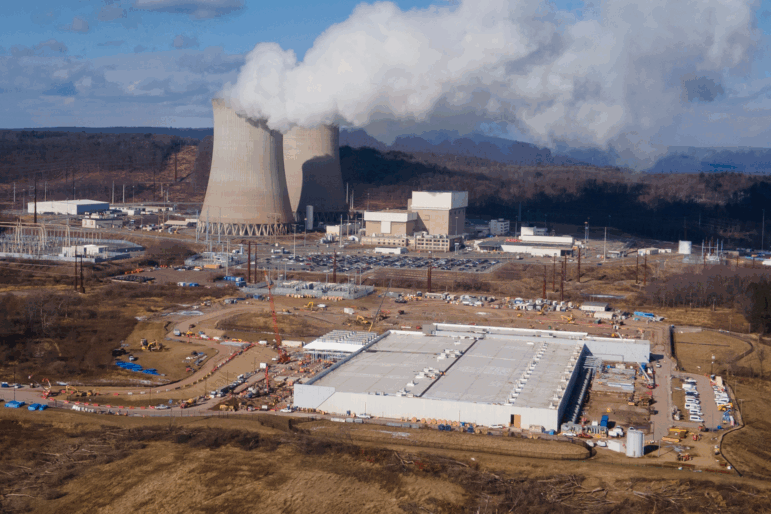 A data center owned by Amazon Web Services, front right, is under construction next to the Susquehanna nuclear power plant in Berwick, Pa., Jan. 14, 2025.