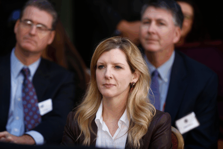 FILE - White House counsel Kathryn Ruemmler listens as President Barack Obama speaks at an installation ceremony for FBI Director James Comey at FBI Headquarters, in Washington, Oct. 28, 2013.