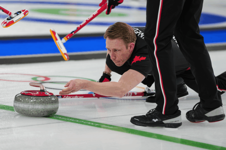 Canada's Marc Kennedy in action during the men's curling round robin session against Sweden, at the 2026 Winter Olympics, in Cortina d'Ampezzo, Italy, Friday, Feb. 13, 2026.
