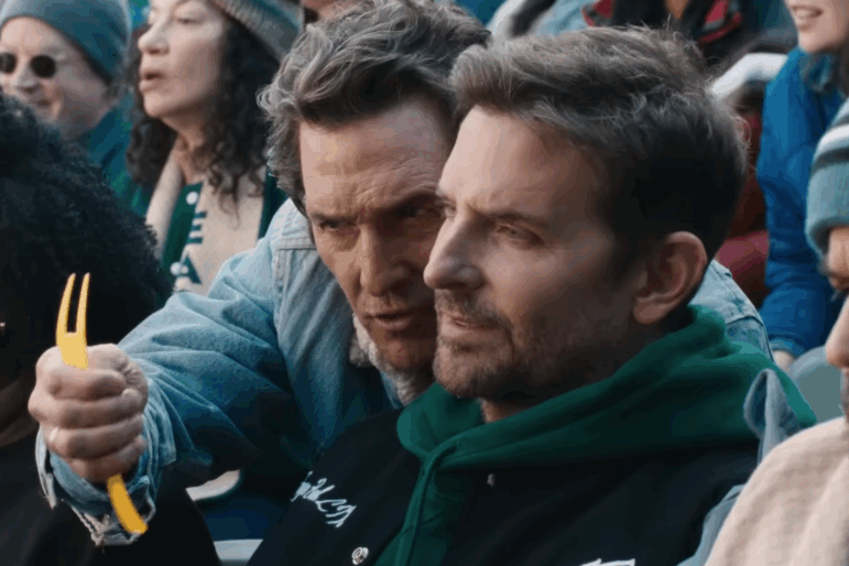Actors Matthew McConaughey and Bradley Cooper appear in an Uber Eats ad linking football to a humorous food sales conspiracy.