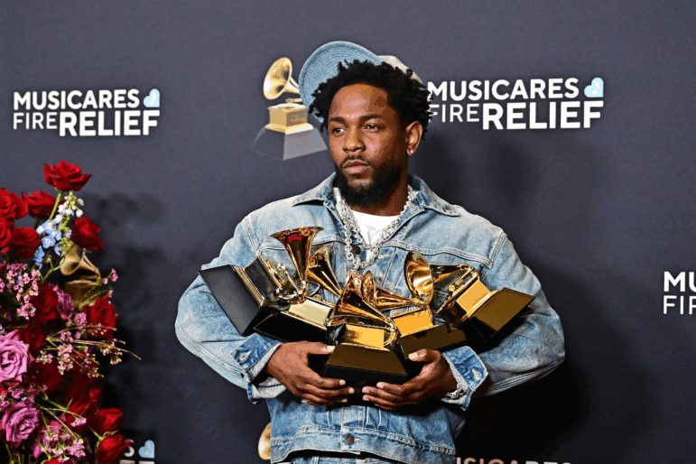 Kendrick Lamar poses with the five awards he won at the 2025 Grammys. In 2026, he is nominated for nine Grammy Awards, including album, record and song of the year.