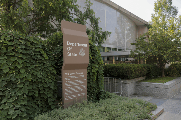 A sign for the U.S. Department of State is seen on the outside of the Harry S. Truman Federal Building on on July 11, 2025 in Washington, DC.
