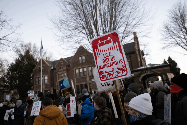 People demonstrate against federal immigration enforcement outside the Minnesota governor's residence in St. Paul on Feb. 6.