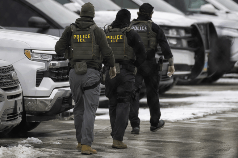 ICE agents depart the Bishop Henry Whipple Federal Building on Feb. 4, 2026 in Minneapolis, Minn.