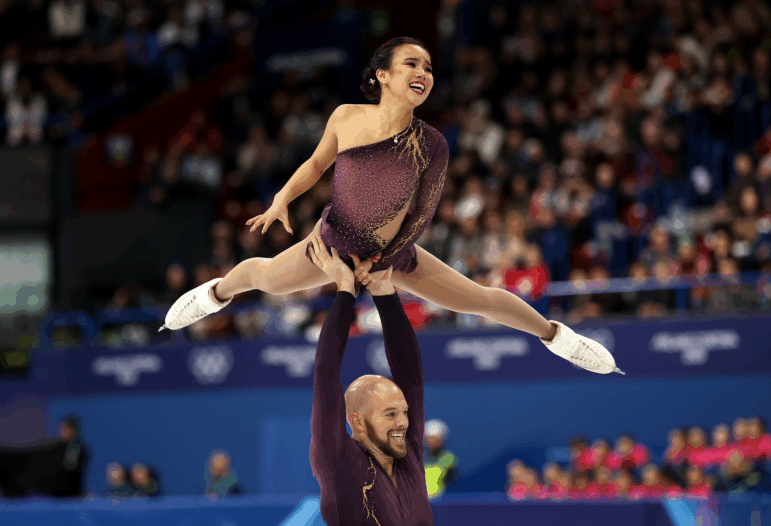 Ellie Kam and partner Danny O'Shea of Team United States compete in the Pair Skating - Short Program at the Milano Cortina 2026 Winter Olympic games at Milano Ice Skating Arena on February 06, 2026 in Milan, Italy.