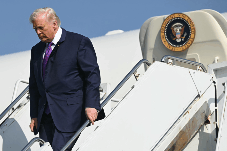 President Trump descends the steps outside Air Force One upon arrival in Rome, Georgia, on February 19.