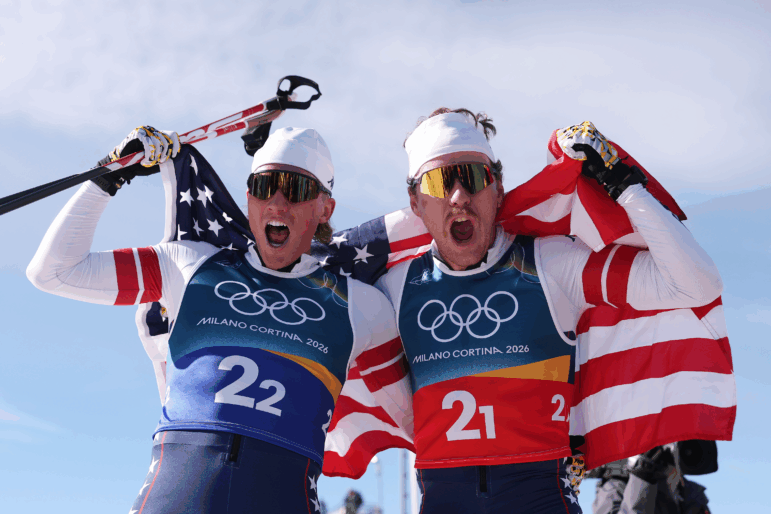 Gus Schumacher, left, and Ben Ogden, of the United States, celebrating a historic win for Team USA in Tesero, Italy, today.