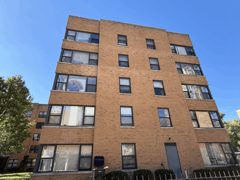 Federal agents repelled out of a Black Hawk helicopter onto the roof of a Chicago South Shore apartment building on September 30, 2025.