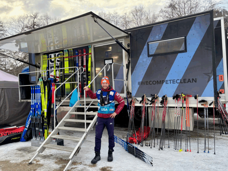 U.S. cross-country ski team coach Matt Whitcomb with Yolanda the wax truck and some of the 600 pairs of skis it holds at a World Cup race in Goms, Switzerland Jan. 23, 2026