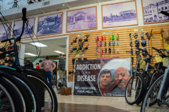 A sign reads “Addiction is a Disease” in James Moore’s bike shop in Hattiesburg, Mississippi, on January 28, 2026. Moore, whose son died from a fentanyl overdose, was part of the advisory council that made recommendations for spending opioid settlement funding to the state legislature.